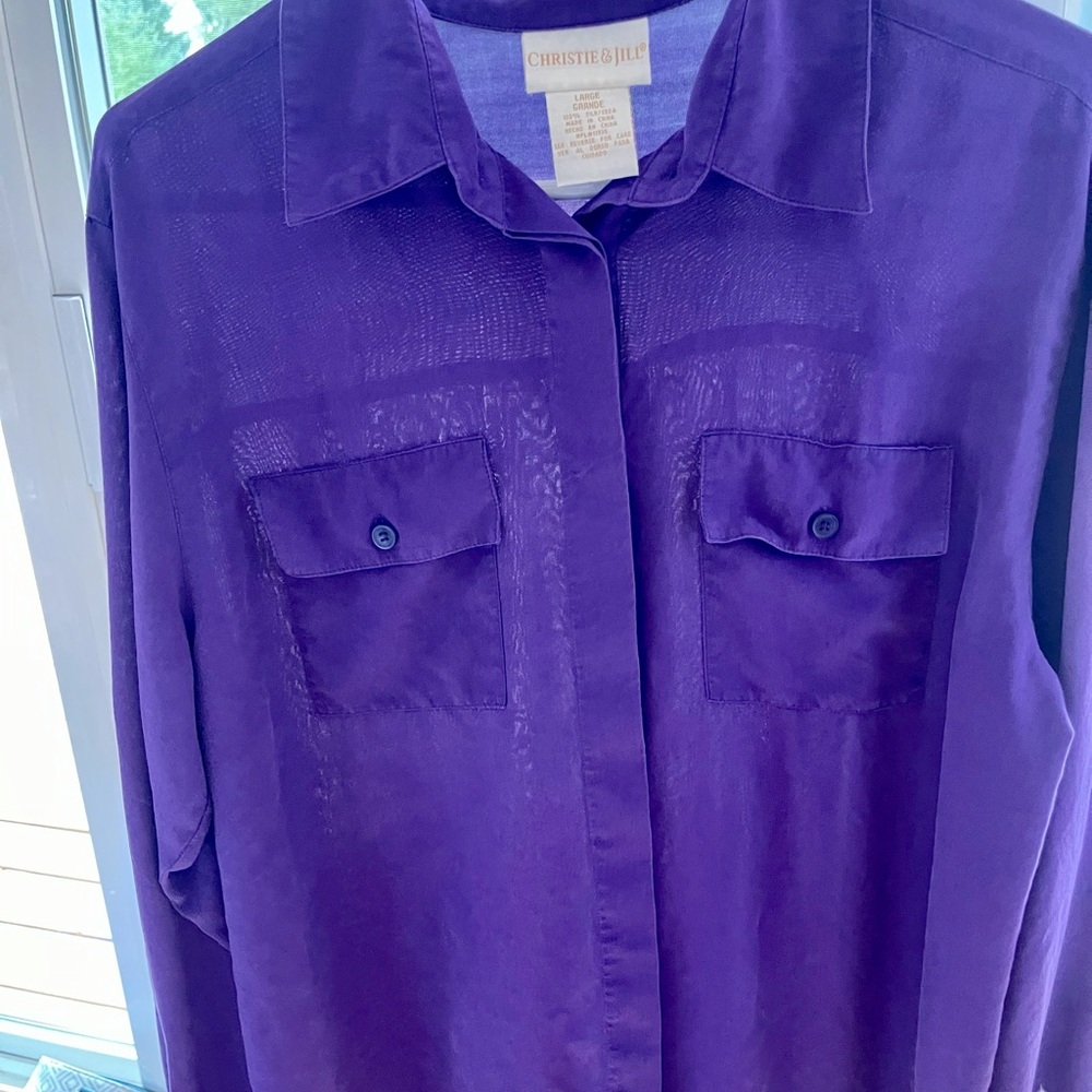 Women’s purple button down shirt.